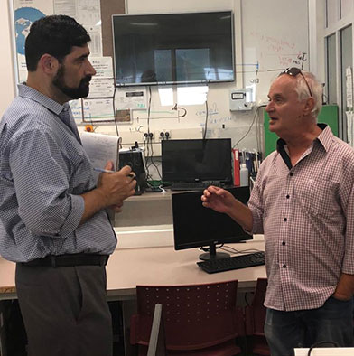 Michael Jeser speaking with Sha'ar HaNegev High School Principal Ahrale Rotshtein