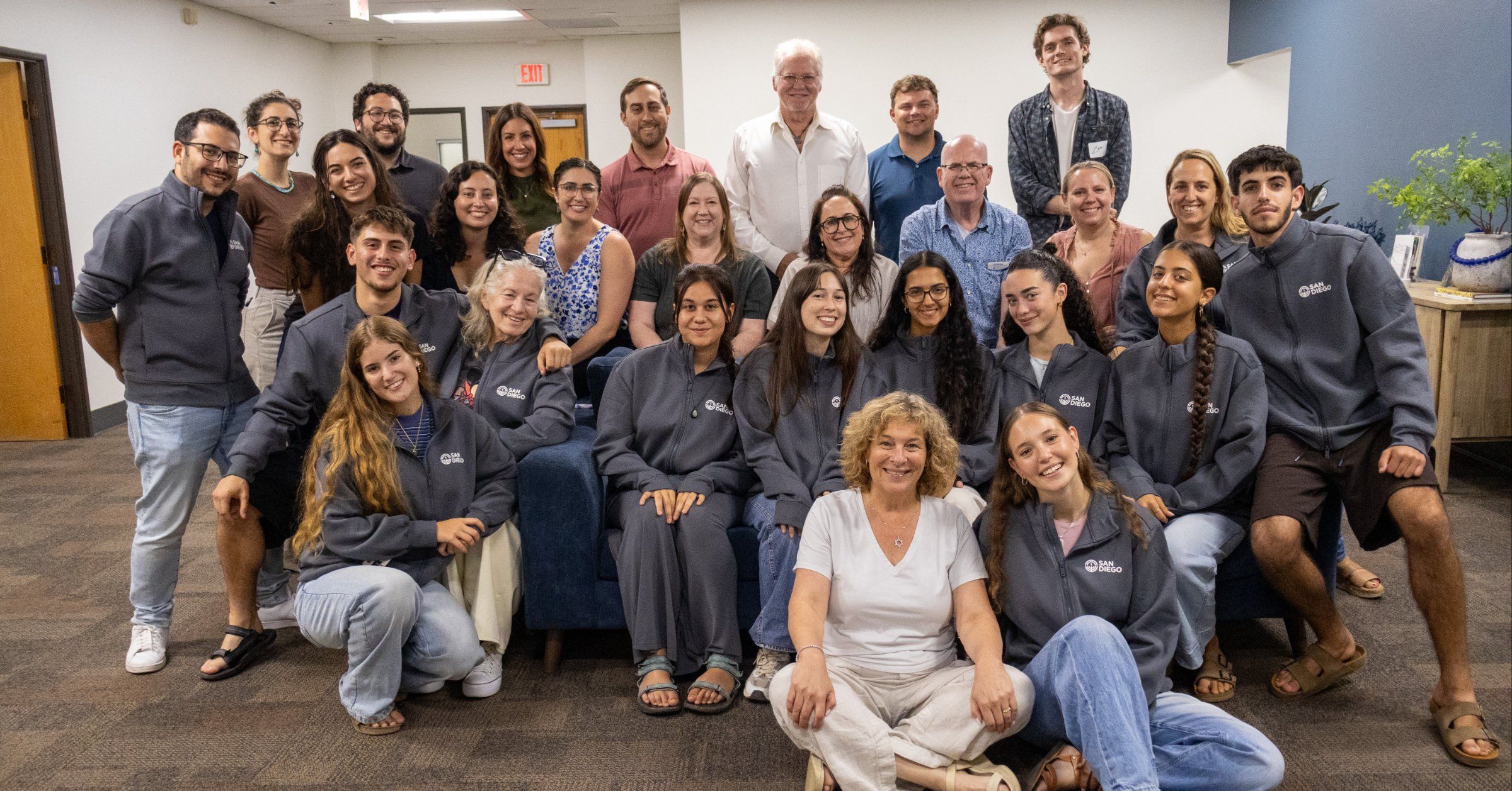 The 2026-27 ShinShinim in their San Diego jackets with Federation staff