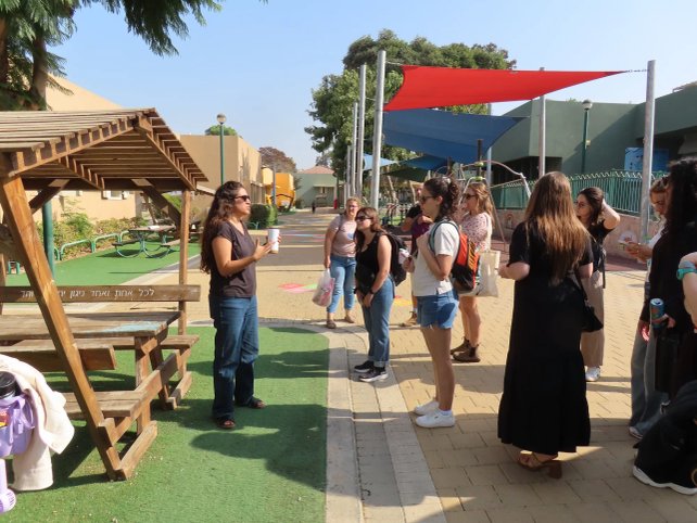 Giborim cohort members from San Diego and Sha'ar HaNegev gathering outdoors in Israel