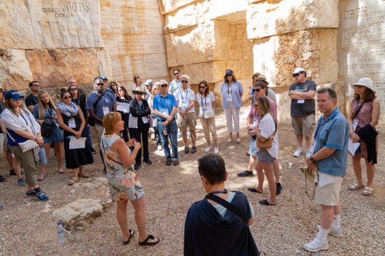 San Diego travelers listening to their guide in Israel on The CommUnity Trip in 2023