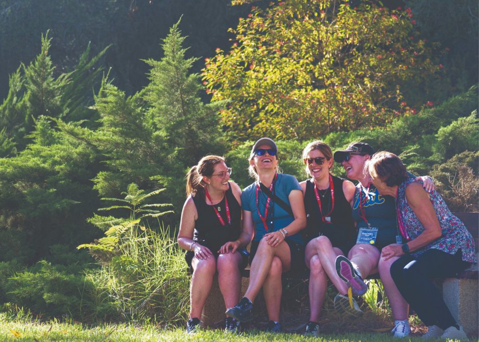 Momentum participants laughing together on a hillside in Israel